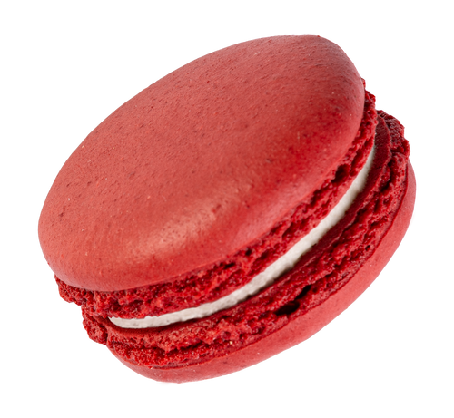 A red velvet macaron with a deep red hue and creamy filling.