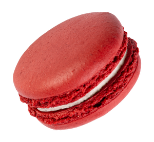 A red velvet macaron with a deep red hue and creamy filling.